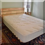F39. Queen platform bed with wood headboard. 42”h 